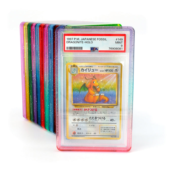 All twelve Espionage PSA Slab Bumper colours fanned out, each holding a graded card
