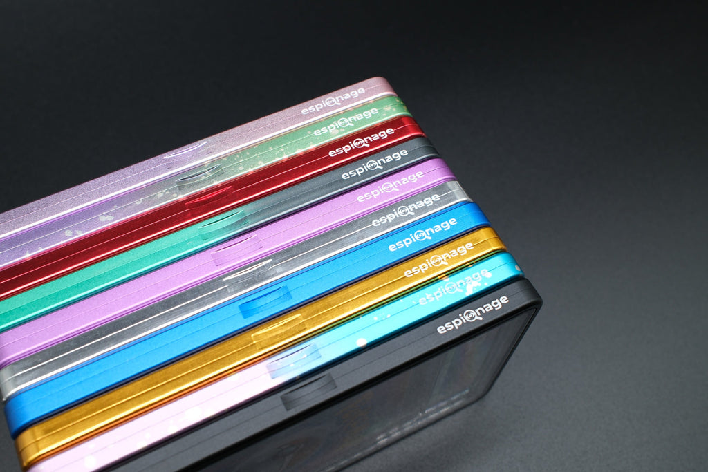 Stack of aluminium slab guards in all ten colours, angled view