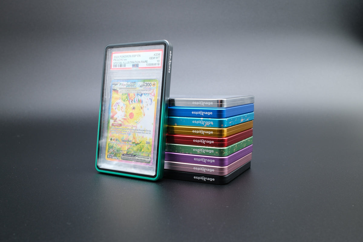 Black and Green Aluminium Slab Guard holding a PSA graded Pokemon card