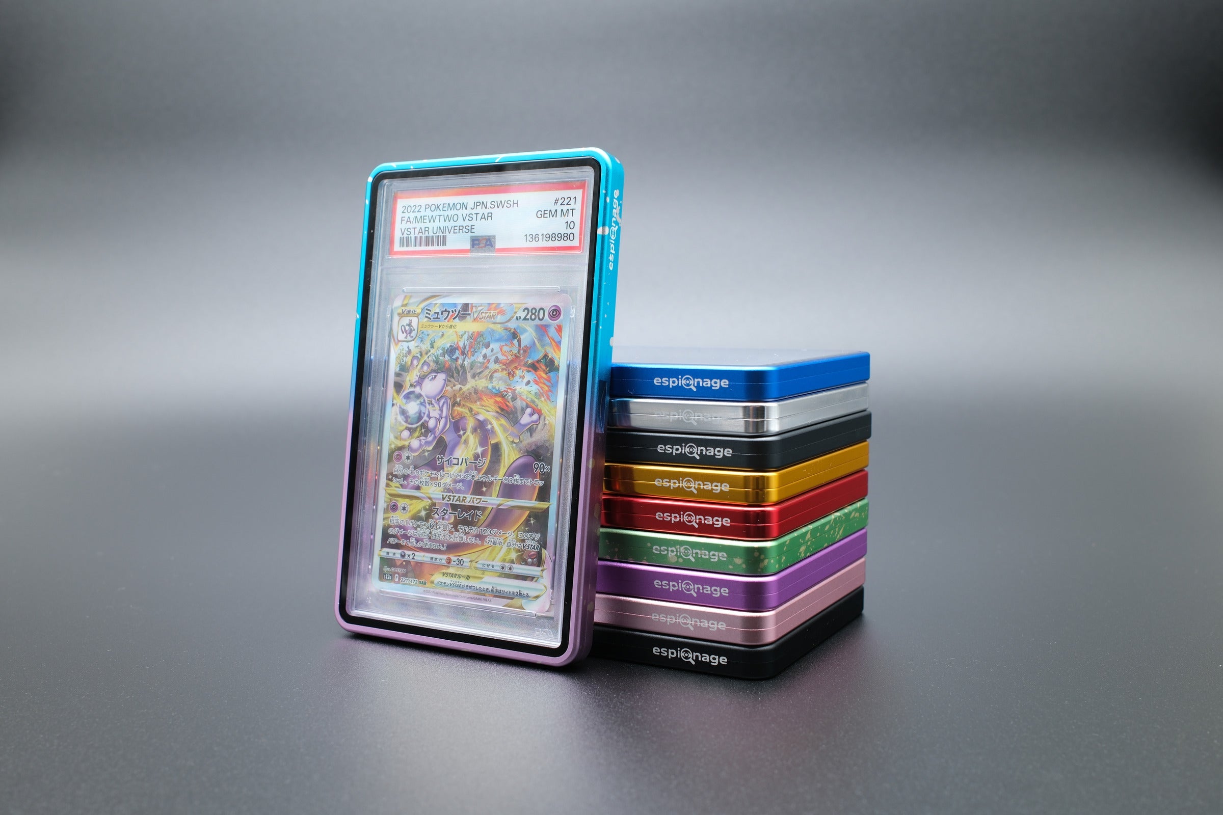 Blue and Purple Speckle Aluminium Slab Guard holding a PSA graded Pokemon card