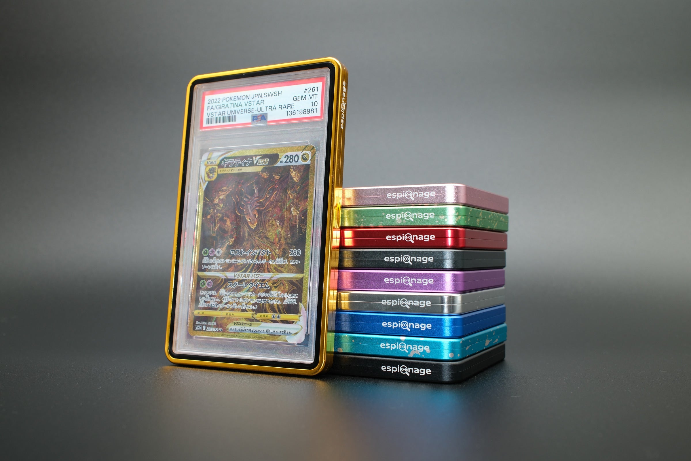 Gold Aluminium Slab Guard holding a PSA graded Pokemon card